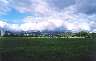 Clouds loom over the inland hills off in the distance beyond the park. 